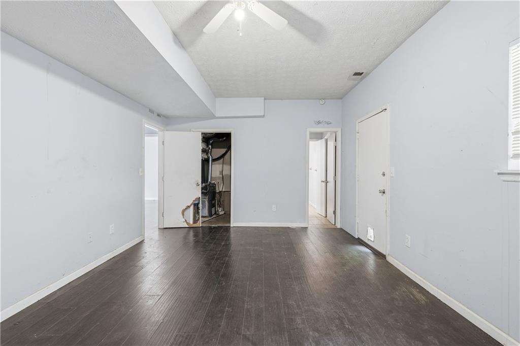 40 Judy Court Stockbridge, GA 30281 - Photo 6 of 20 a view of an empty room with wooden floor and a window