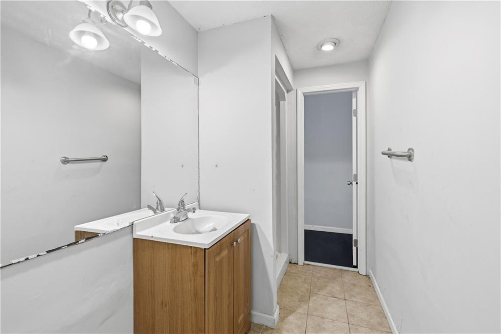 40 Judy Court Stockbridge, GA 30281 - Photo 7 of 20 a bathroom with a sink vanity and a mirror