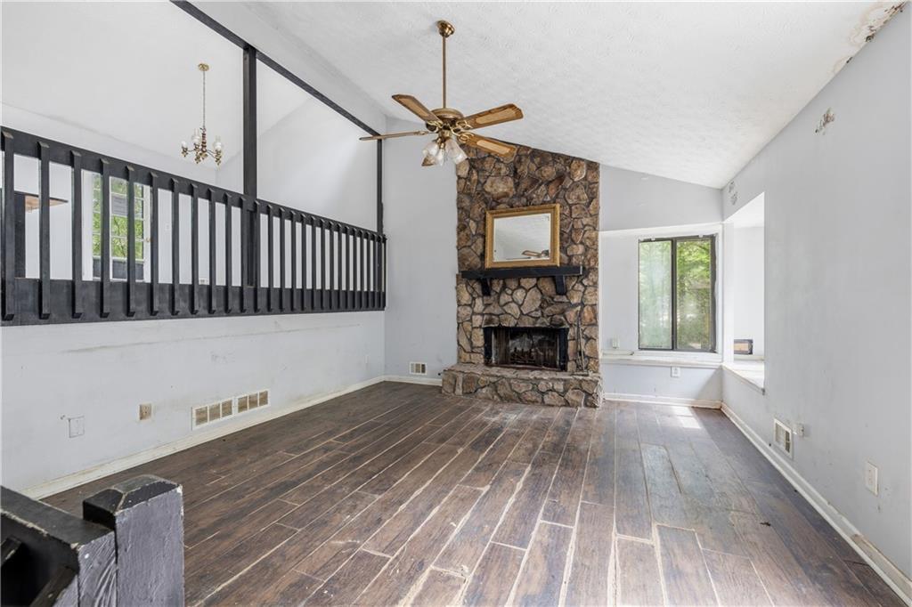 40 Judy Court Stockbridge, GA 30281 - Photo 8 of 20 a view of empty room with wooden floor fireplace and a window