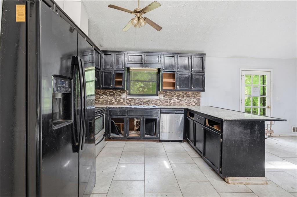 40 Judy Court Stockbridge, GA 30281 - Photo 10 of 20 a kitchen with stainless steel appliances granite countertop a stove and a refrigerator