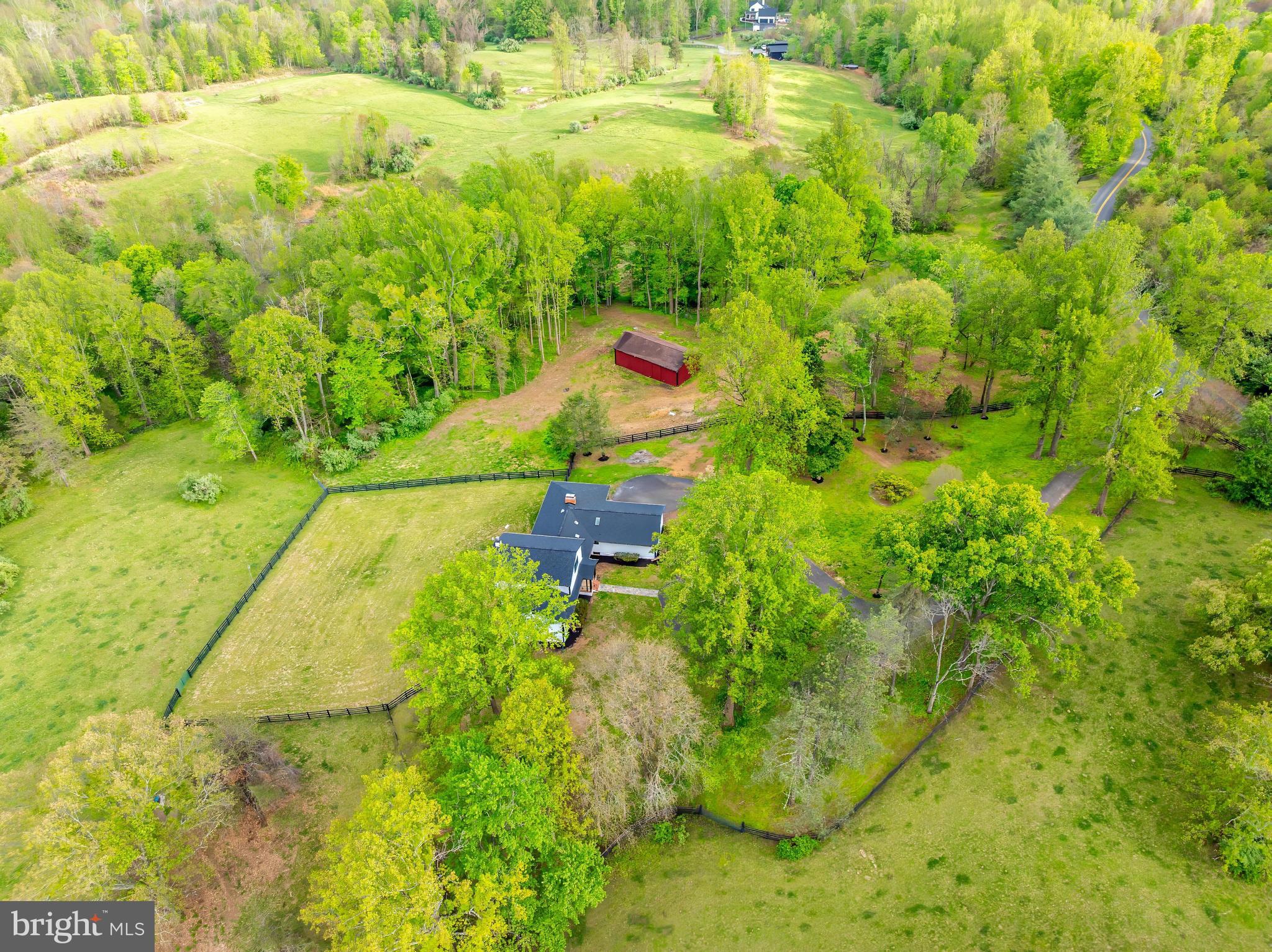 6891 Wilson Road Marshall, VA 20115 - Photo 25 of 118 Serene countryside retreat surrounded by greenery.