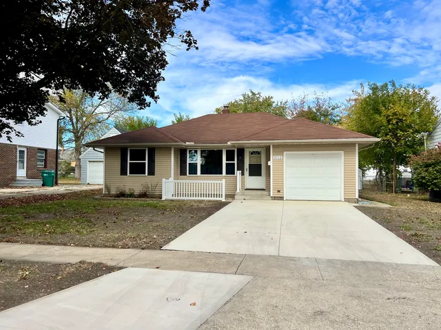 front view of a house next to a yard