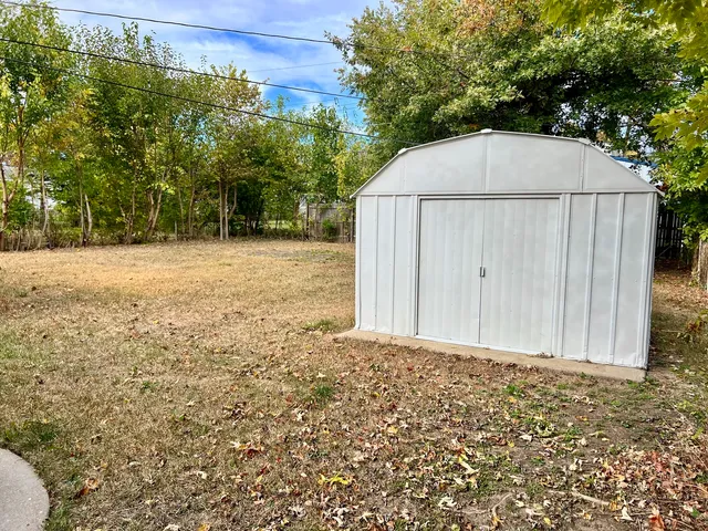 a backyard of a house with lots of green space