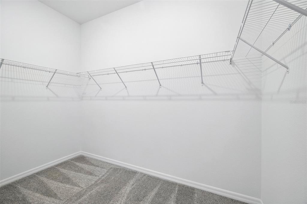 27517 Stellar Sea Way Howey-in-the-Hills, FL 34737 - Photo 12 of 17 a view of a rack on the wall