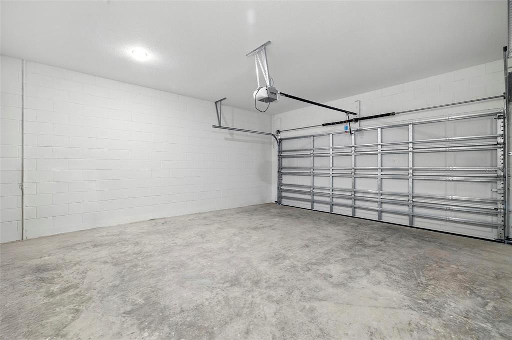 27517 Stellar Sea Way Howey-in-the-Hills, FL 34737 - Photo 9 of 17 a view of a garage