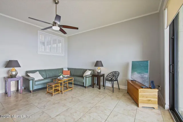 a living room with furniture and a lamp