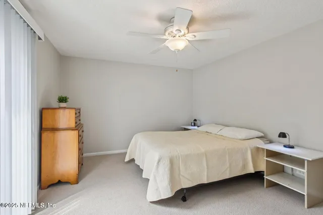 an empty room with furniture and a window