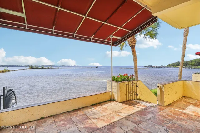 a view of balcony with furniture