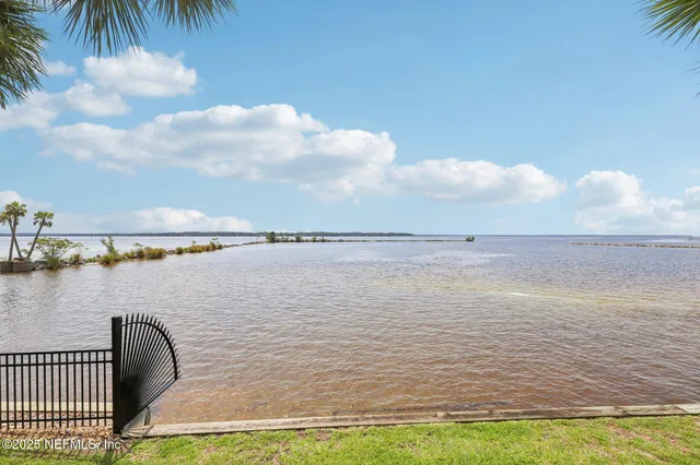a view of swimming pool from a lake view