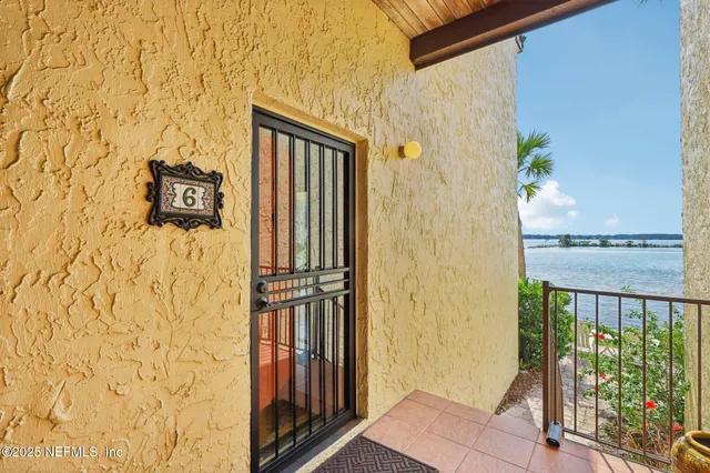a view of a livingroom with furniture and a window
