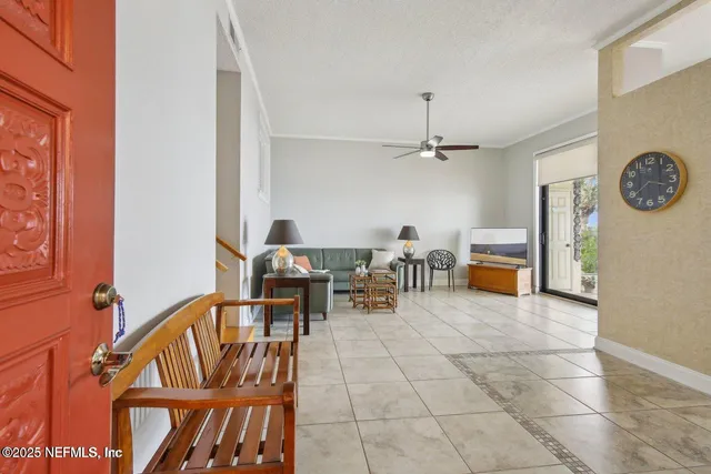 a view of a livingroom with furniture and kitchen