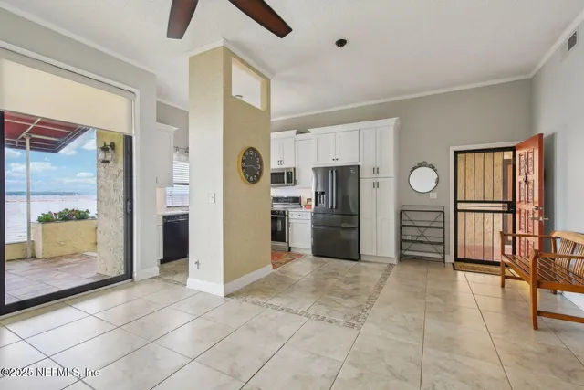 a kitchen with stainless steel appliances granite countertop a refrigerator and a stove