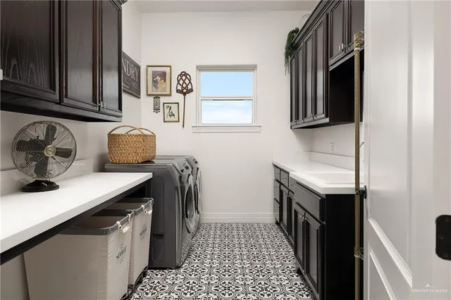 a kitchen with stainless steel appliances granite countertop a sink stove top oven and cabinets