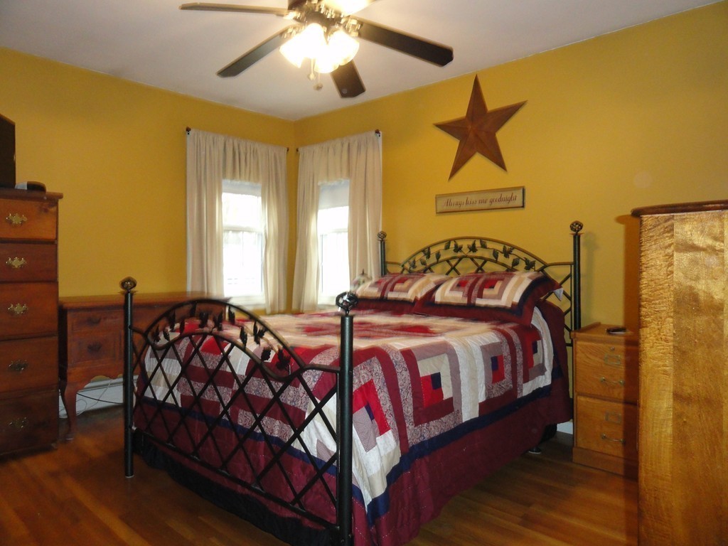 12 Laurelwood Road Rutland, MA 01543 - Photo 13 of 25 a bedroom with a bed and wooden floor