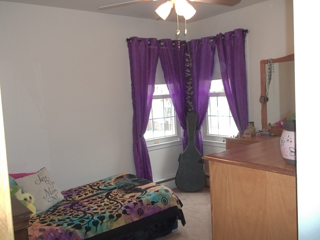 12 Laurelwood Road Rutland, MA 01543 - Photo 14 of 25 a bedroom with a bed and a chandelier
