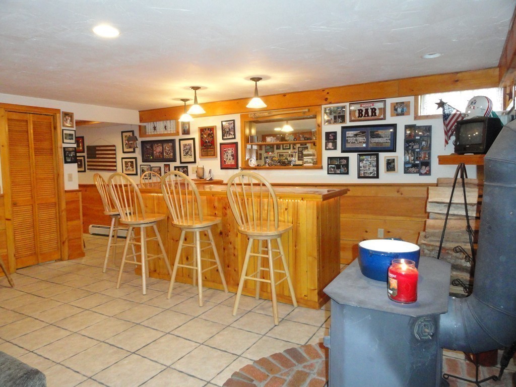 12 Laurelwood Road Rutland, MA 01543 - Photo 16 of 25 a view of a patio with table and chairs