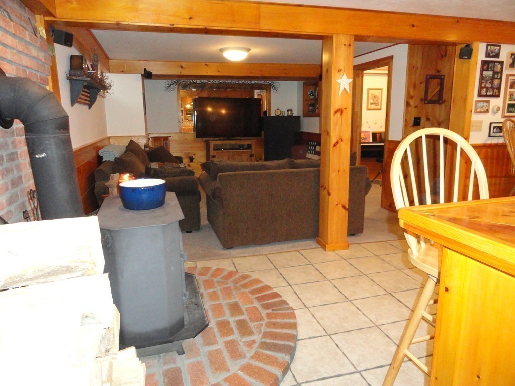 12 Laurelwood Road Rutland, MA 01543 - Photo 19 of 25 a view of living room with furniture and a flat screen tv