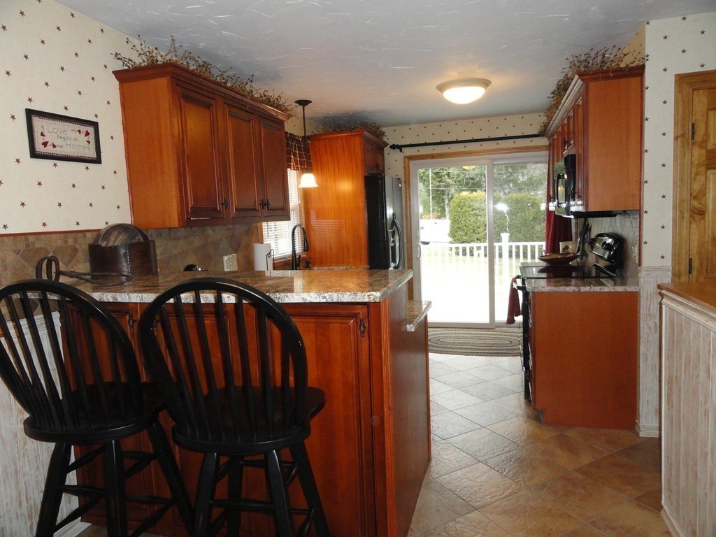 12 Laurelwood Road Rutland, MA 01543 - Photo 8 of 25 a view of kitchen with furniture and large windows