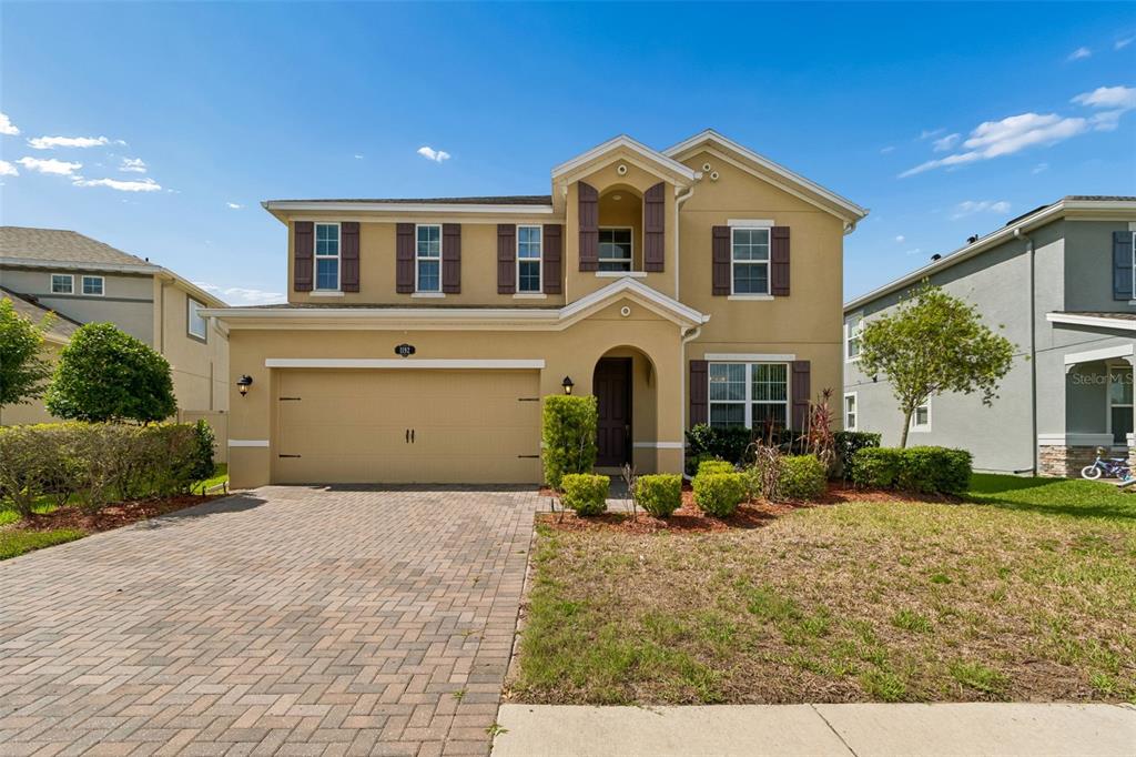 1192 Multiflora Loop Lutz, FL 33558 - Photo 4 of 32 a view of a house with backyard and sitting area