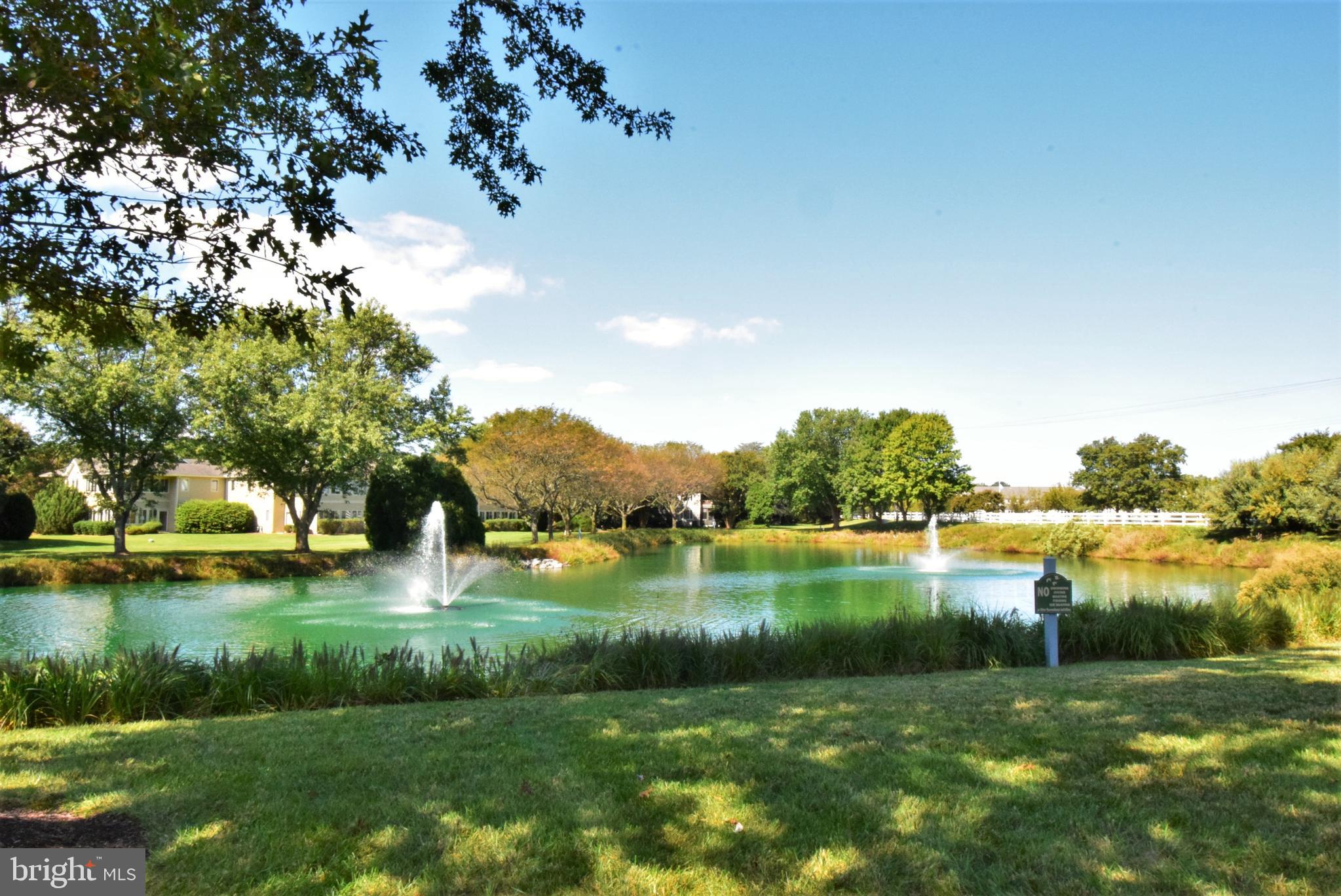 18419 Berkeley Road, Unit 6 Lewes, DE 19958 - Photo 15 of 18 Lovely mature landscape and fountain ponds