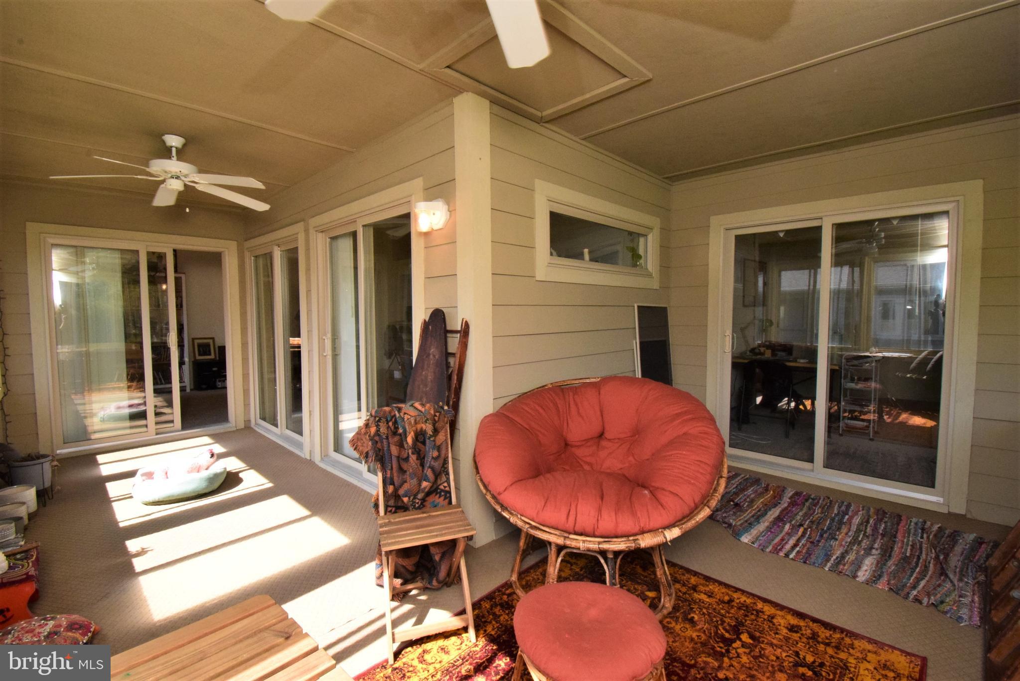 18419 Berkeley Road, Unit 6 Lewes, DE 19958 - Photo 8 of 18 Another angle of the sunroom, connects to a 2nd BR
