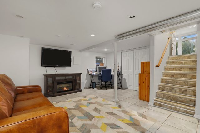 306 North Elmhurst Road Prospect Heights, IL 60070 - Photo 16 of 26 a living room with furniture and a flat screen tv