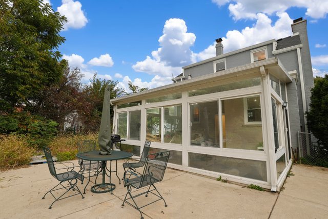 306 North Elmhurst Road Prospect Heights, IL 60070 - Photo 20 of 26 a view of a house with a table and chairs