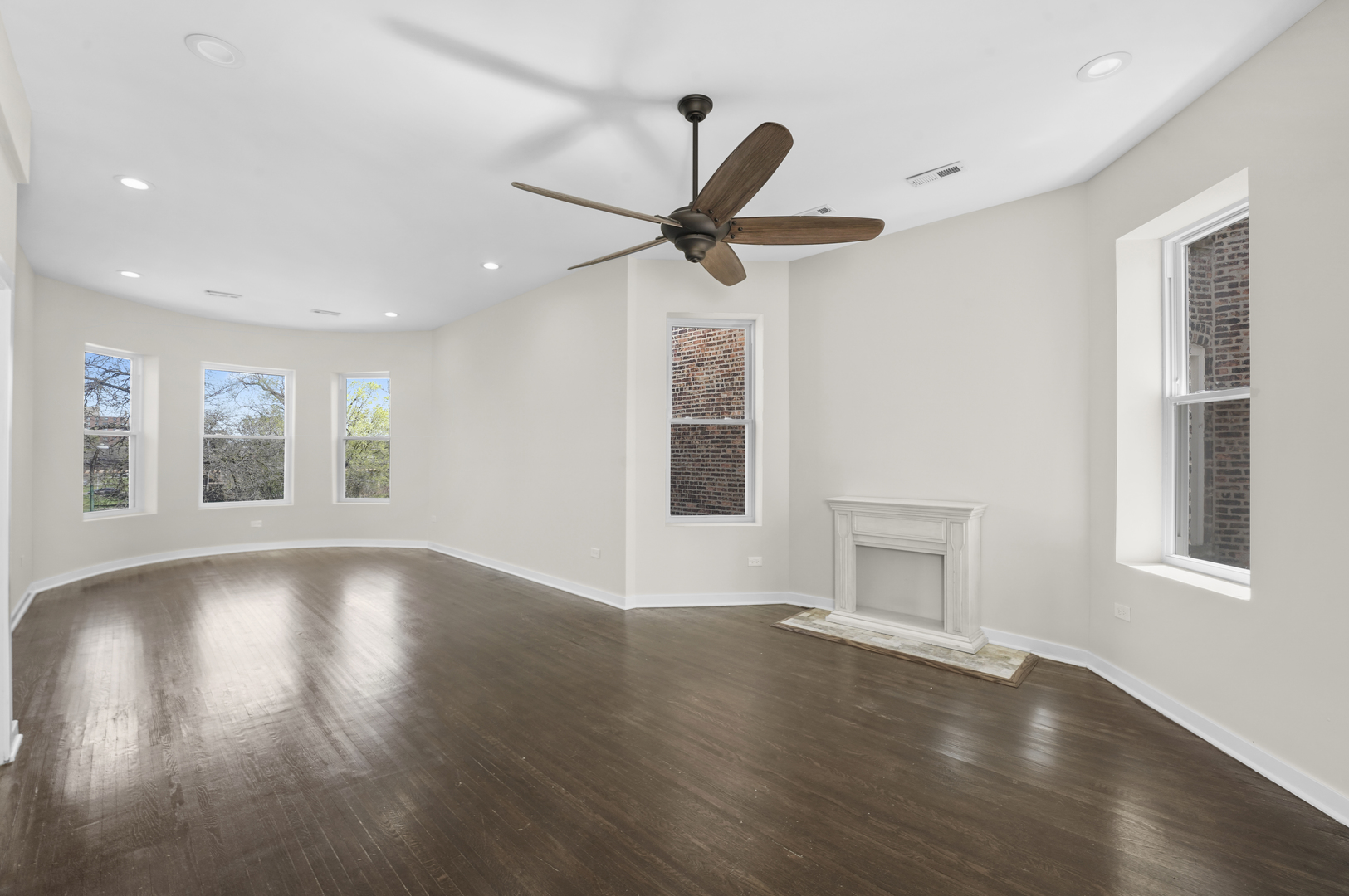 6014 South Prairie Avenue, Unit 2 Chicago, IL 60637 - Photo 2 of 10 a view of an empty room with window and wooden floor