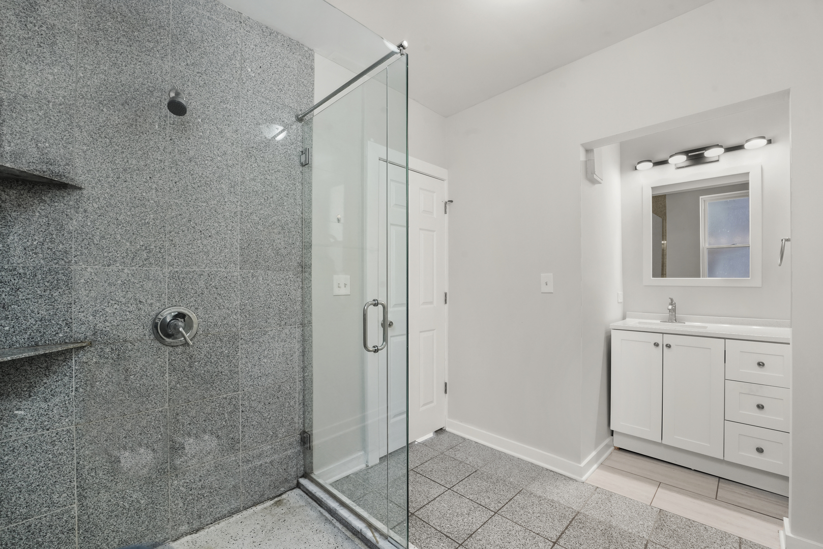 6014 South Prairie Avenue, Unit 2 Chicago, IL 60637 - Photo 9 of 10 a bathroom with a shower and a sink