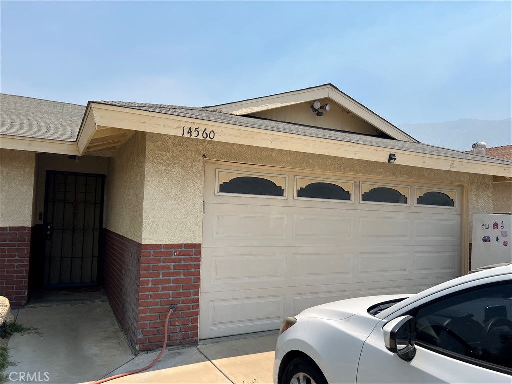 14560 Mission Street Cabazon, CA 92230 - Photo 6 of 6 a front view of a house with parking space