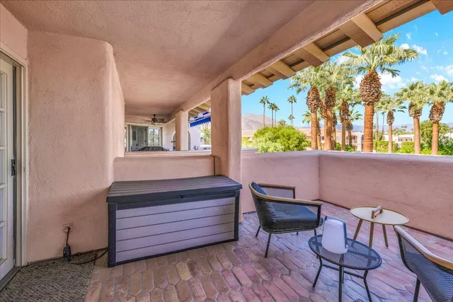 a view of a two chairs in the patio