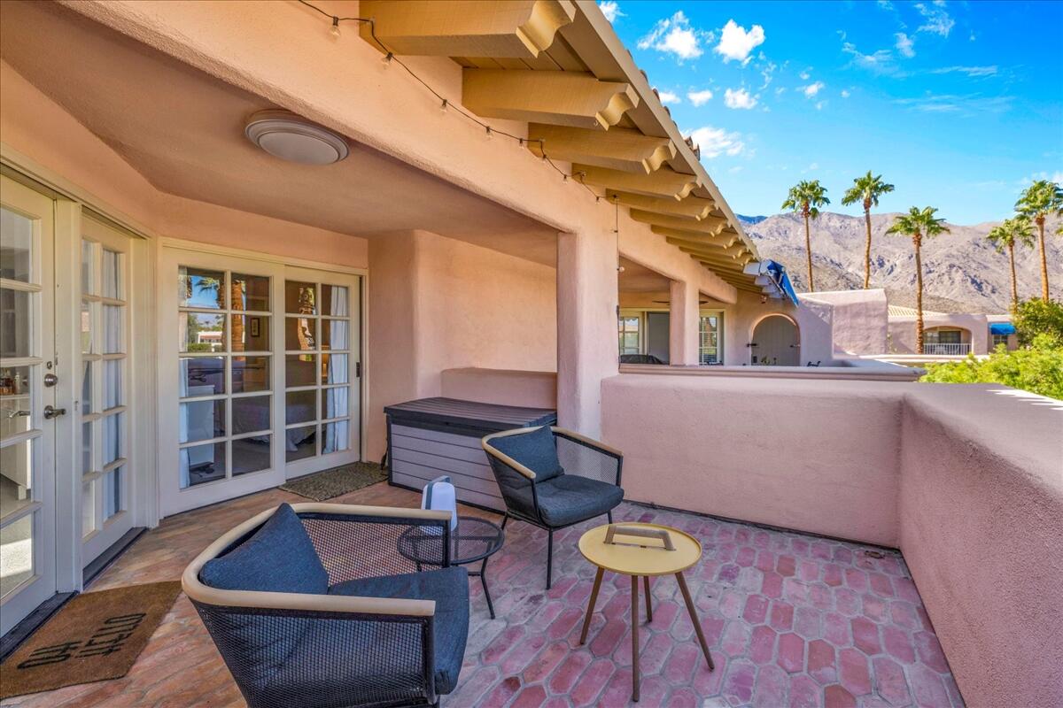 500 East Amado Road, Unit 416 Palm Springs, CA 92262 - Photo 28 of 48 a view of a chairs and table in the balcony