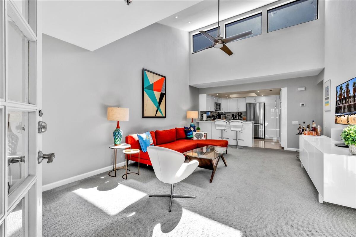 500 East Amado Road, Unit 416 Palm Springs, CA 92262 - Photo 3 of 48 a living room with furniture and a rug