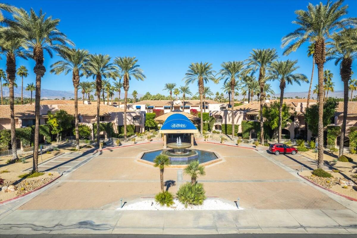500 East Amado Road, Unit 416 Palm Springs, CA 92262 - Photo 40 of 48 a swimming pool with outdoor seating and yard