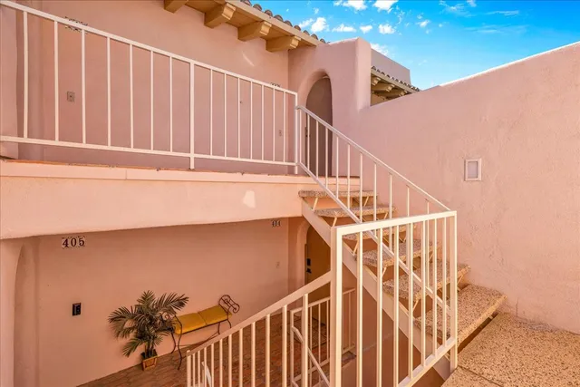 a view of a swimming pool with a table and chairs