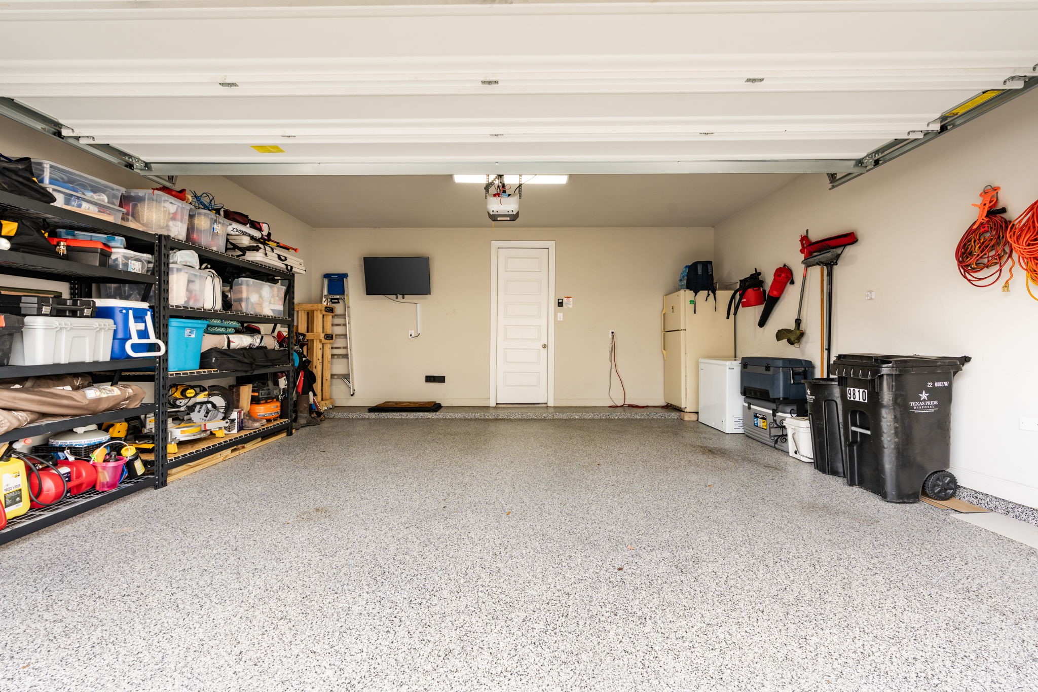9810 Falling Fern Lane Houston, TX 77080 - Photo 16 of 30 a view of a garage with storage