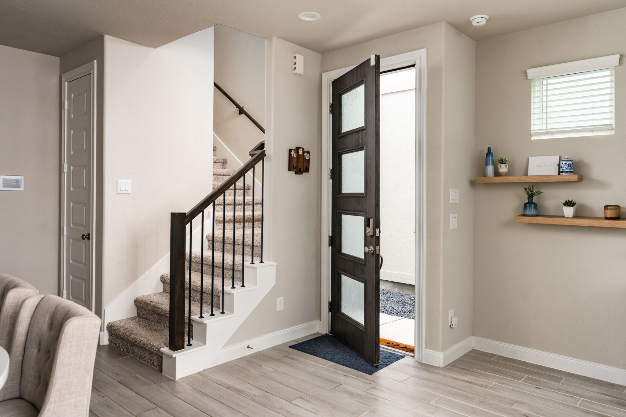 9810 Falling Fern Lane Houston, TX 77080 - Photo 4 of 30 a view of entryway with wooden floor and stairs