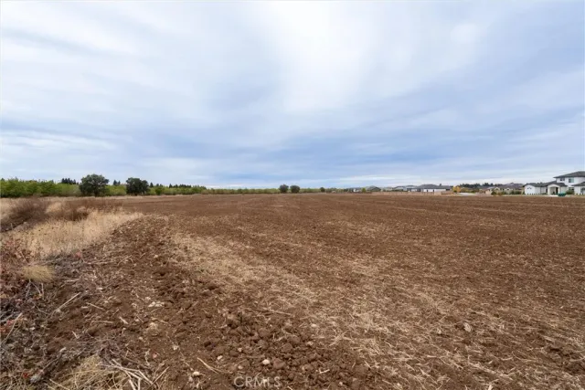 a view of a lake with houses in the back