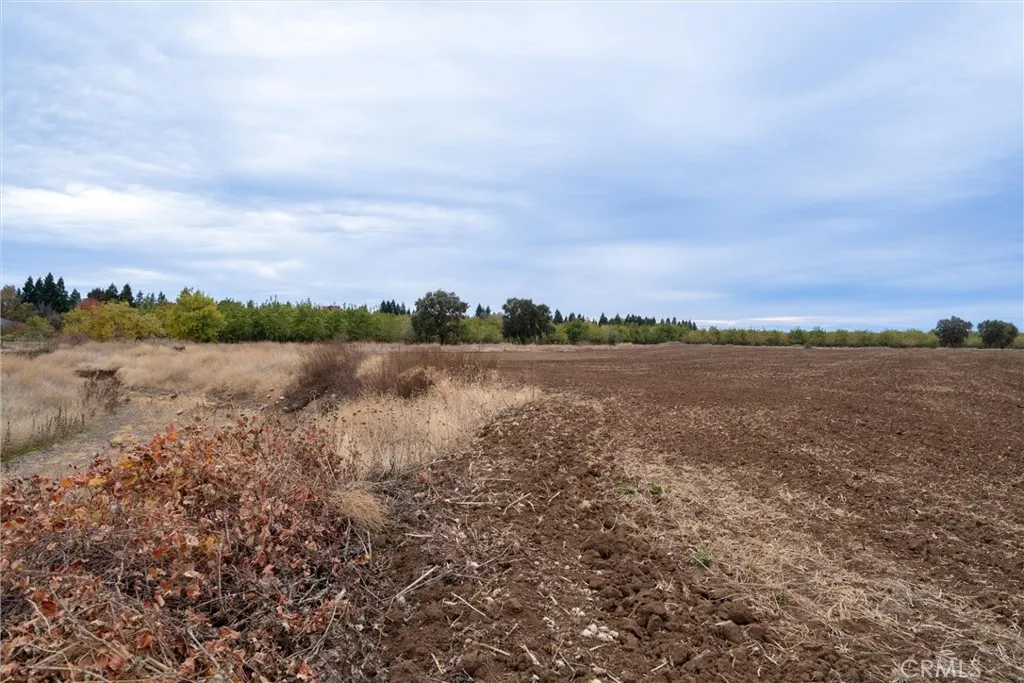 0 Garner Lane Chico, CA 95973 - Photo 10 of 17 a view of a lake with houses in the back
