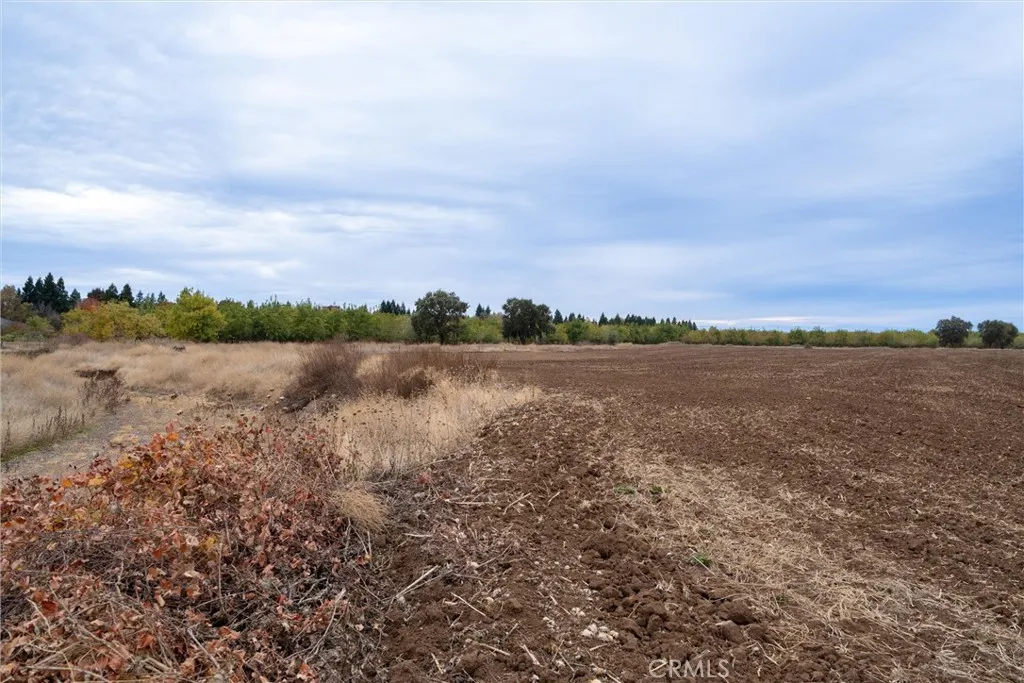 0 Garner Lane Chico, CA 95973 - Photo 10 of 17 a view of a lake with houses in the back