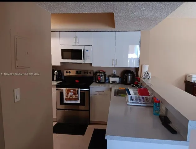 $290,000 | 18870 Northwest 57th Avenue, Unit 108, Hialeah, FL 33015