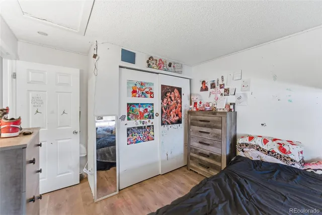 a kitchen with a refrigerator and cabinets