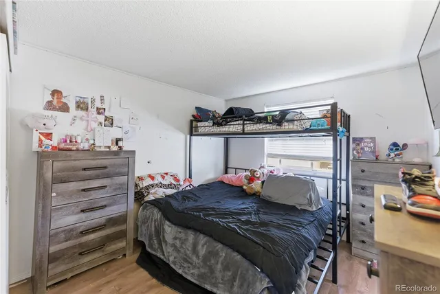 a bedroom with a bed and a closet