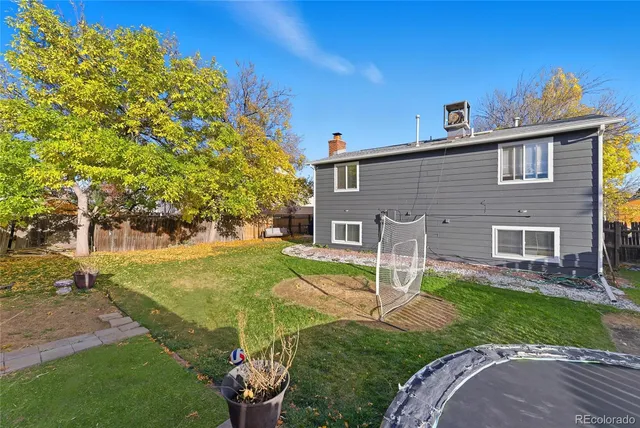 a view of a house with a yard porch and sitting area