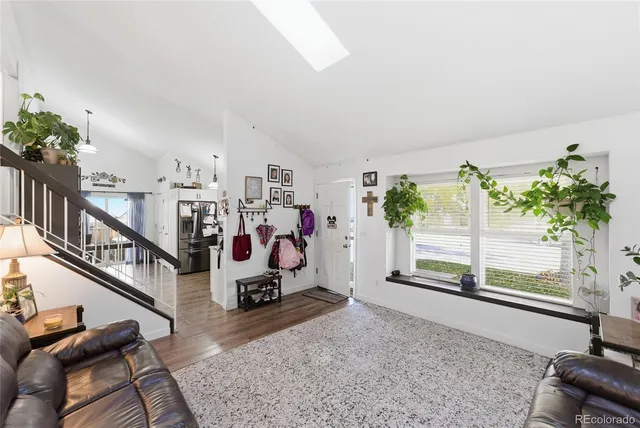 a view of a living room and entryway
