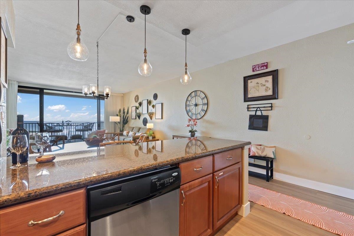 3445 Lower Honoapiilani Road, Unit 361 Lahaina, HI 96761 - Photo 13 of 43 a kitchen with kitchen island a counter space a sink and a large mirror
