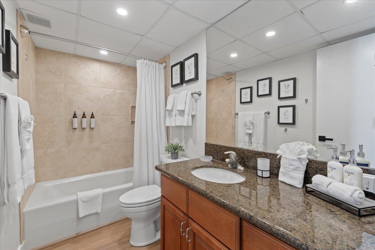 3445 Lower Honoapiilani Road, Unit 361 Lahaina, HI 96761 - Photo 27 of 43 a bathroom with a granite countertop sink toilet and shower