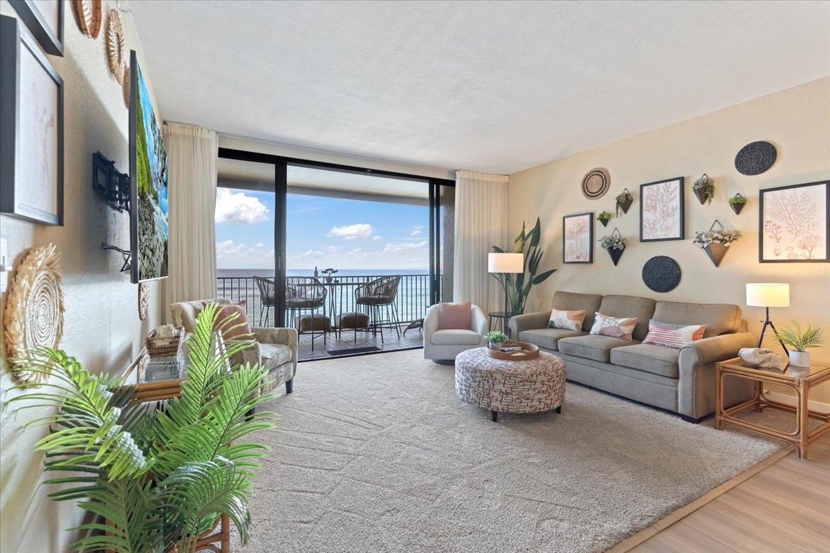 3445 Lower Honoapiilani Road, Unit 361 Lahaina, HI 96761 - Photo 4 of 43 a living room with furniture and a large window