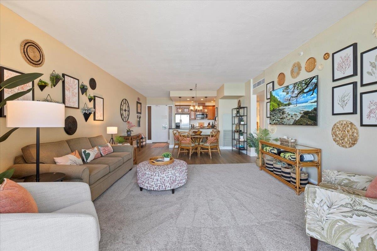 3445 Lower Honoapiilani Road, Unit 361 Lahaina, HI 96761 - Photo 7 of 43 a living room with furniture and painting on the wall