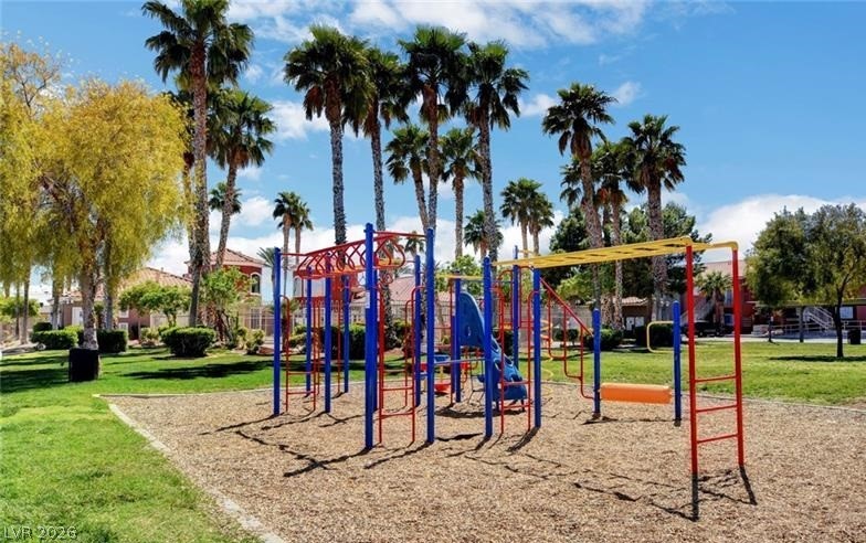 4730 East Craig Road, Unit 2102 Las Vegas, NV 89115 - Photo 9 of 13 A vibrant playground, nestled amongst verdant lawns and tall palm trees, offers recreational delight.